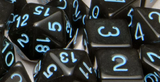 SET OF 15 DICE: TRANSLUCENT BLACK/LT BLUE ARCH'D4 (Special Order)